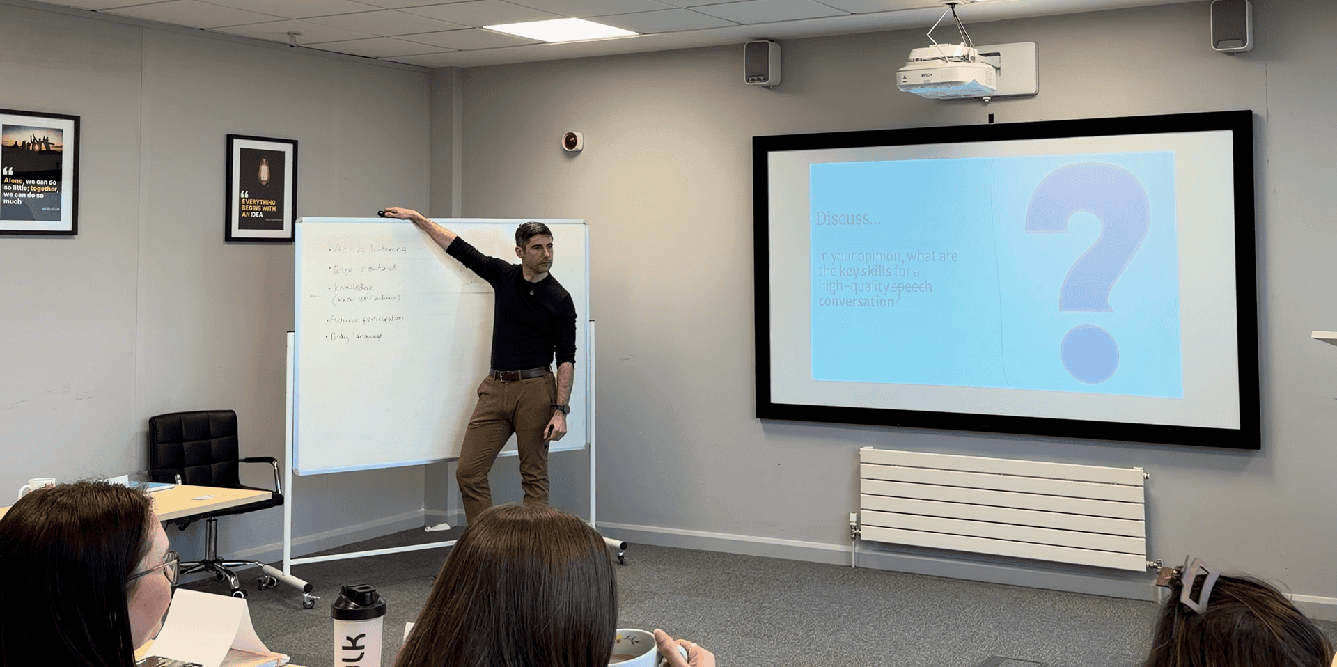 Aaron presenting in a meeting room